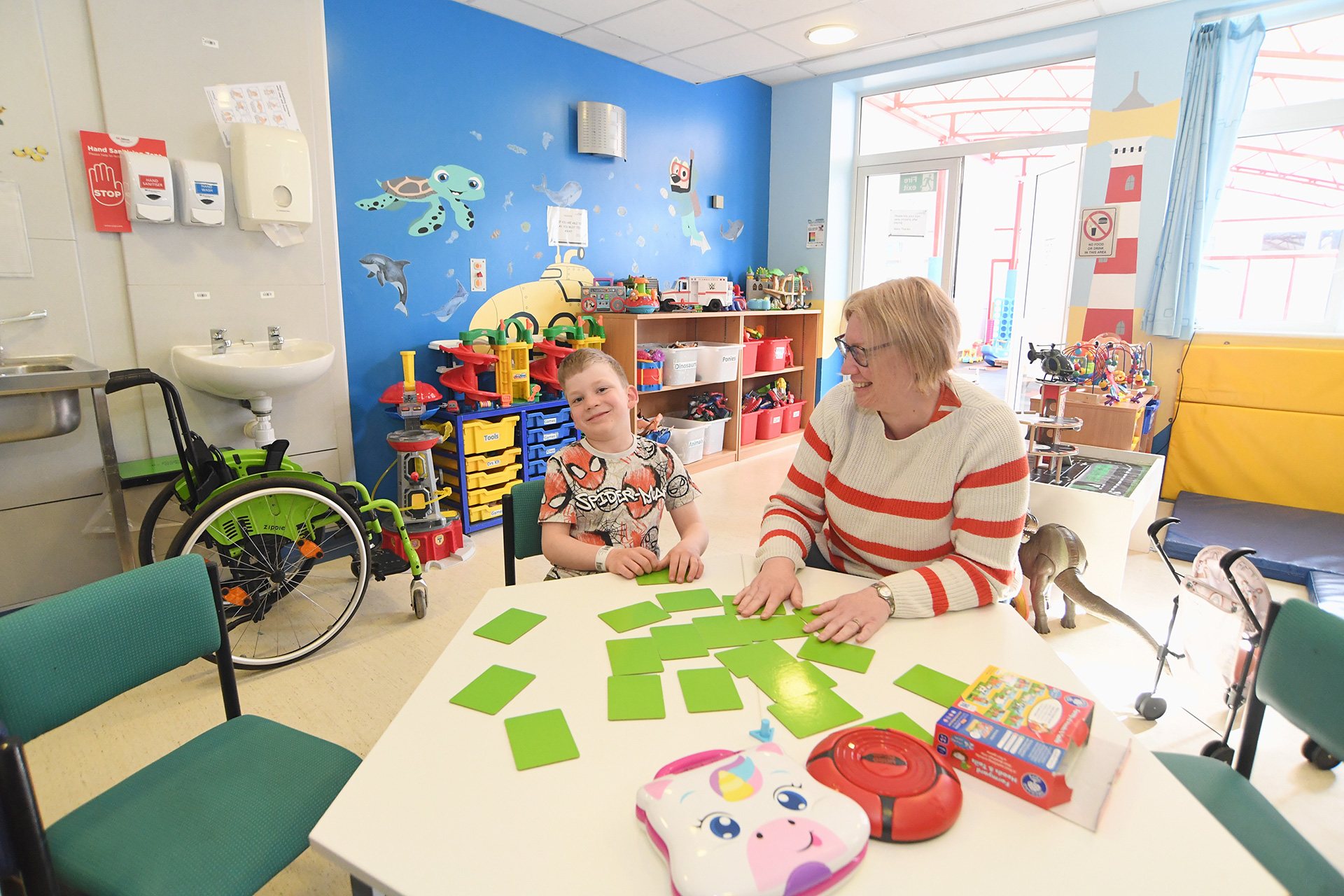 A child and carer enjoying a hospital play space